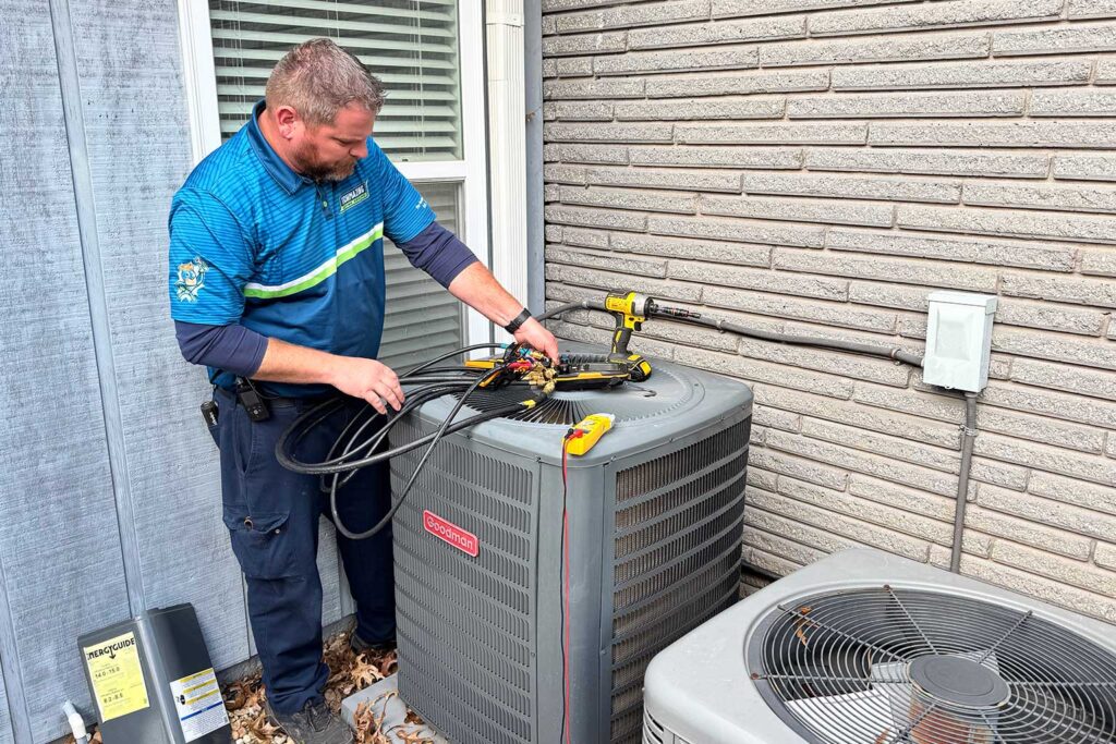 Techmazing tech performing maintenance on an HVAC unit